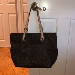 Brown and tan Michael Kors medium sized bag